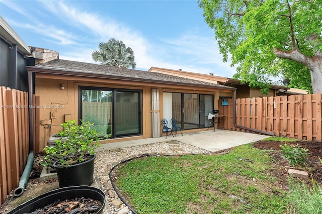 rear view of house featuring a patio area