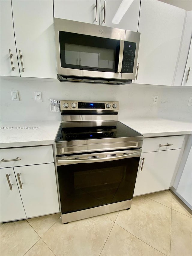 kitchen with stainless steel appliances and white cabinets