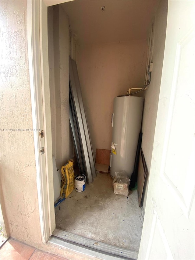 utility room with water heater