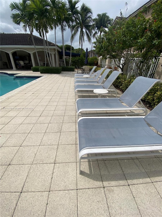 view of swimming pool with a patio