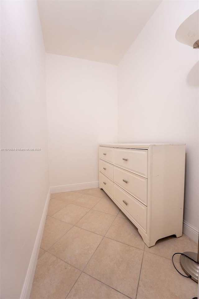 spacious closet featuring light tile patterned flooring