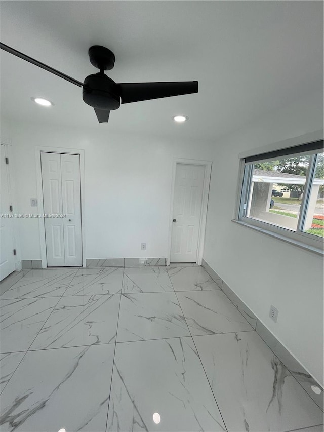 spare room featuring ceiling fan