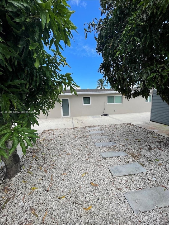 rear view of house with a patio area