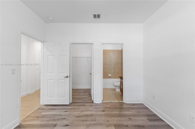 11959 SW 26th Ct, Miramar, FL 33025 - unfurnished bedroom featuring a walk in closet, visible vents, tile patterned floors, and a closet