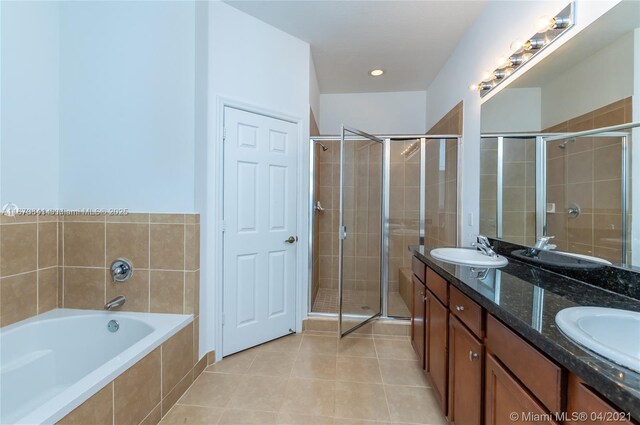 tiled empty room featuring sink