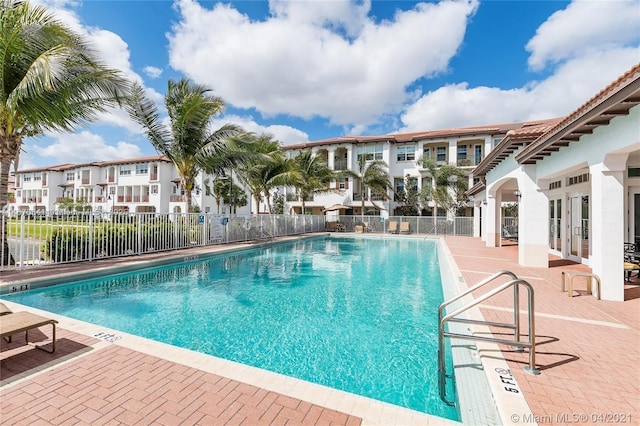 view of swimming pool featuring a patio area