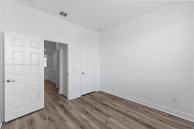 11959 SW 26th Ct, Miramar, FL 33025 - unfurnished bedroom featuring wood finished floors, visible vents, and baseboards