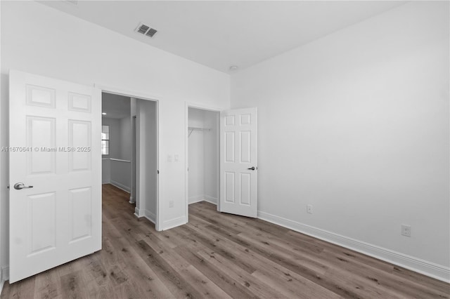 11959 SW 26th Ct, Miramar, FL 33025 - unfurnished bedroom featuring wood finished floors, visible vents, a closet, and baseboards