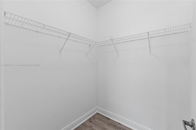 11959 SW 26th Ct, Miramar, FL 33025 - hall featuring baseboards, wood finished floors, and an upstairs landing