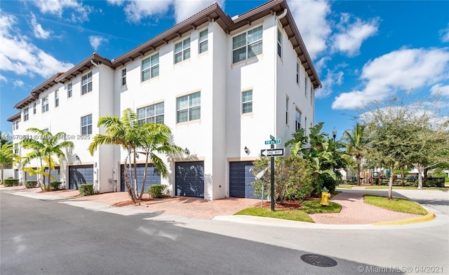 11959 SW 26th Ct, Miramar, FL 33025 - view of building exterior featuring driveway and an attached garage