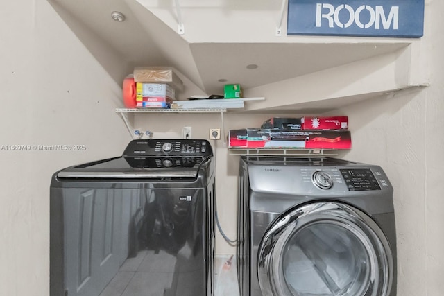 laundry area with washer and dryer