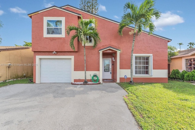 view of front of home with a front lawn and a garage