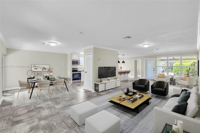 living room with ornamental molding