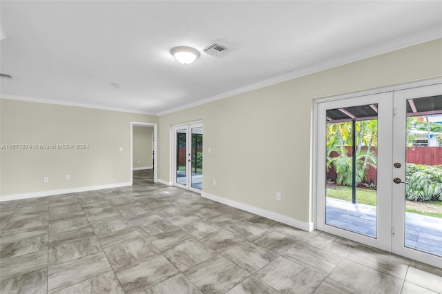 unfurnished room featuring french doors and ornamental molding