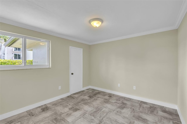 unfurnished room with crown molding