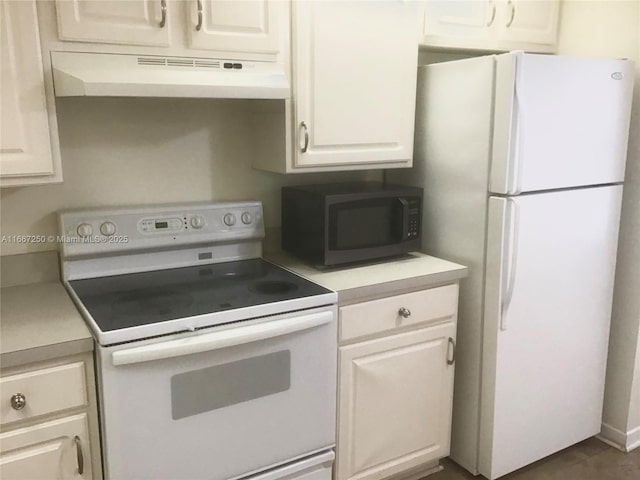 kitchen featuring white cabinetry and white appliances