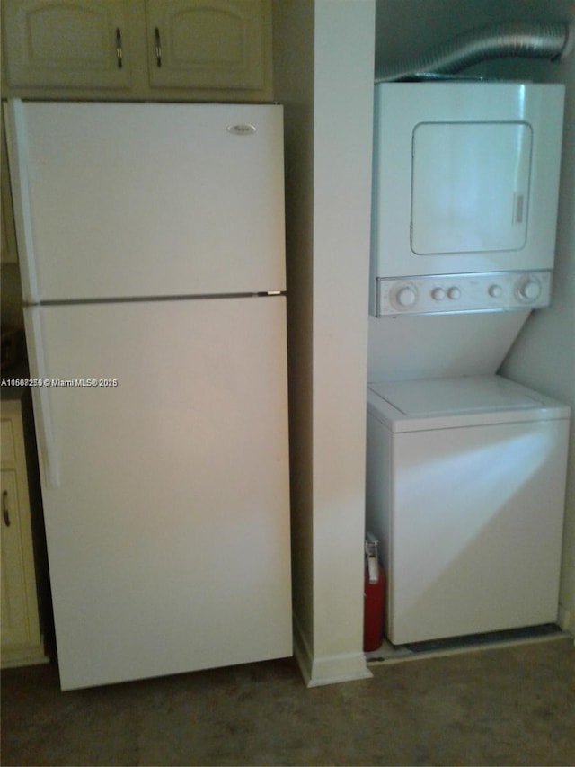 701 SW 142nd Ave Unit 104S, Pembroke Pines, FL 33027 - laundry area with stacked washer and clothes dryer