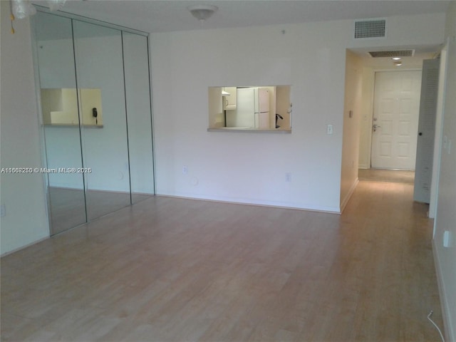 701 SW 142nd Ave Unit 104S, Pembroke Pines, FL 33027 - unfurnished room featuring wood finished floors