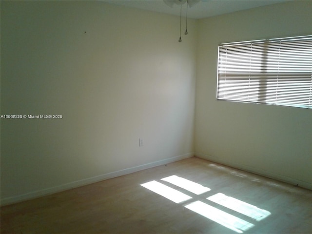 701 SW 142nd Ave Unit 104S, Pembroke Pines, FL 33027 - empty room with baseboards and wood finished floors
