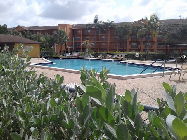 701 SW 142nd Ave Unit 104S, Pembroke Pines, FL 33027 - community pool with a patio