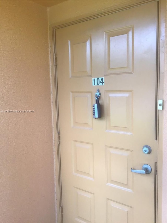 701 SW 142nd Ave Unit 104S, Pembroke Pines, FL 33027 - view of exterior entry with stucco siding
