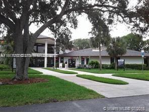 701 SW 142nd Ave Unit 104S, Pembroke Pines, FL 33027 - view of property's community with a lawn
