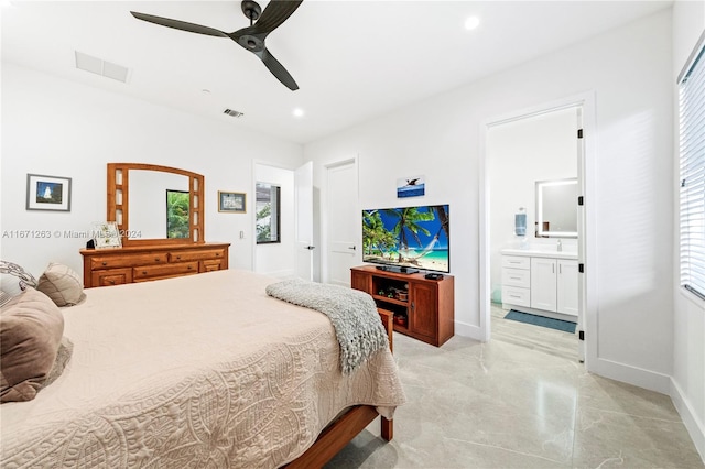 bedroom featuring ensuite bathroom and ceiling fan