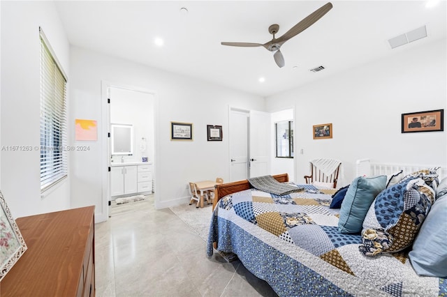 bedroom featuring sink, ensuite bathroom, and ceiling fan