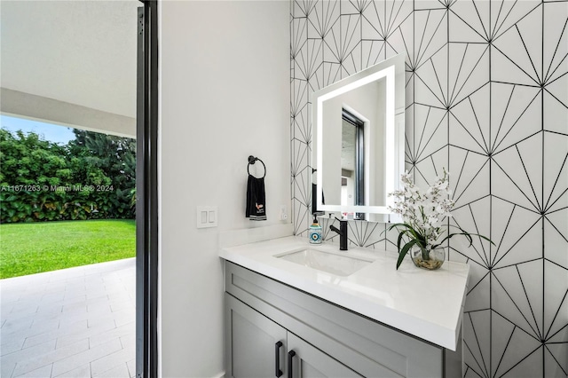 bathroom with tile walls and vanity