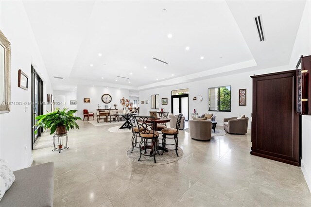 dining room with a tray ceiling