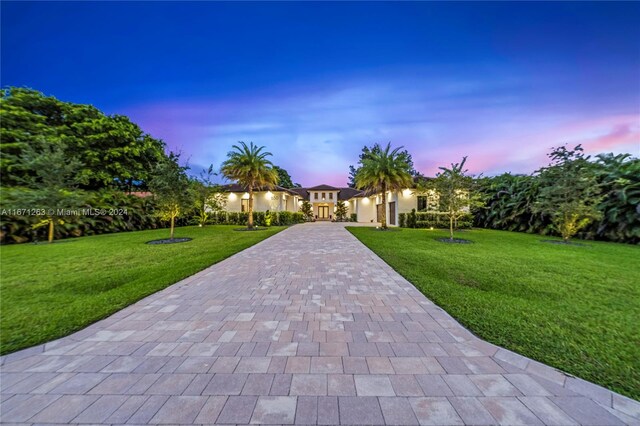 view of front of property with a lawn