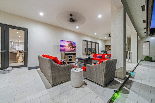 exterior space featuring french doors, an outdoor living space, and ceiling fan