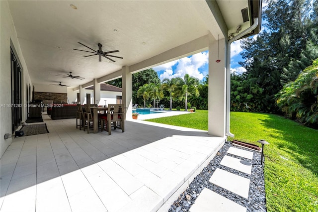 view of patio / terrace featuring ceiling fan