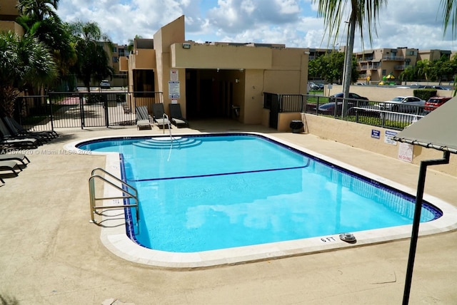 view of pool featuring a patio