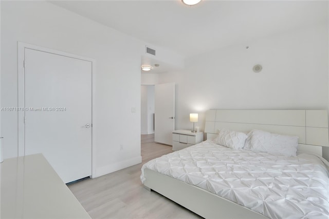 bedroom with light hardwood / wood-style flooring