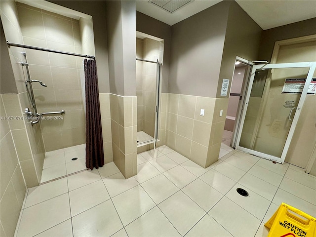 bathroom featuring tile walls, tile patterned floors, and a shower with shower curtain