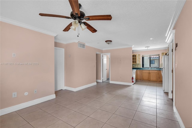 unfurnished living room featuring a textured ceiling, ceiling fan, light tile patterned flooring, and crown molding