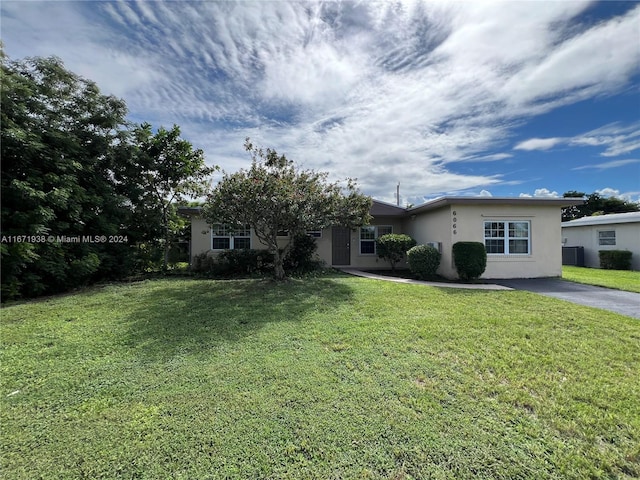 ranch-style home with a front yard