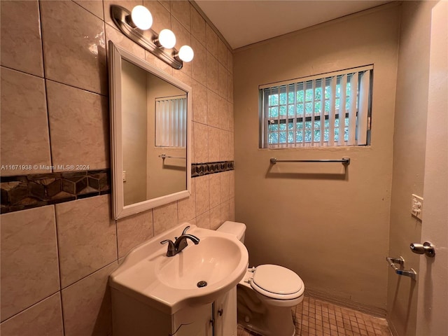 bathroom featuring tile walls, tile patterned floors, vanity, and toilet