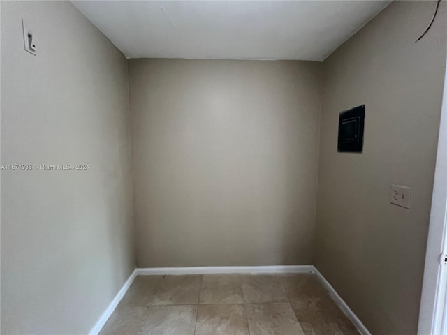 spare room featuring light tile patterned floors