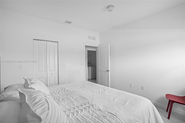 bedroom with carpet and a closet