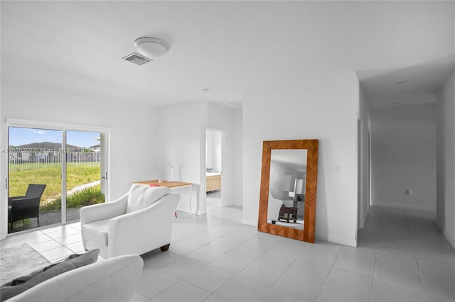 living room with light tile patterned floors