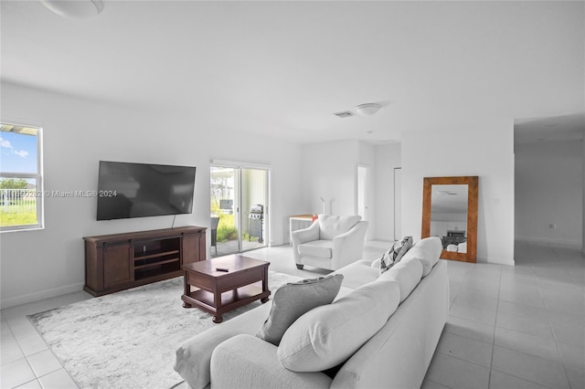 living room with light tile patterned flooring