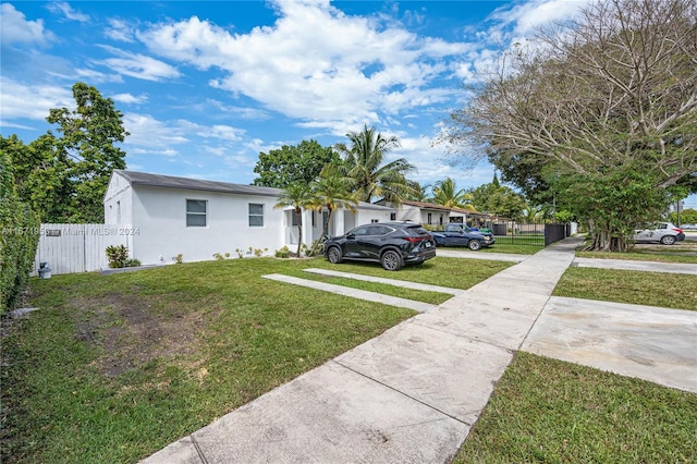 view of front of home with a front lawn