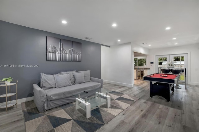 playroom featuring french doors, pool table, and light hardwood / wood-style floors