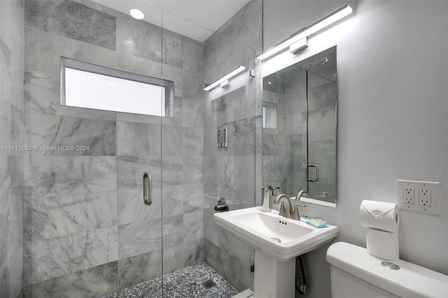 bathroom with walk in shower and toilet