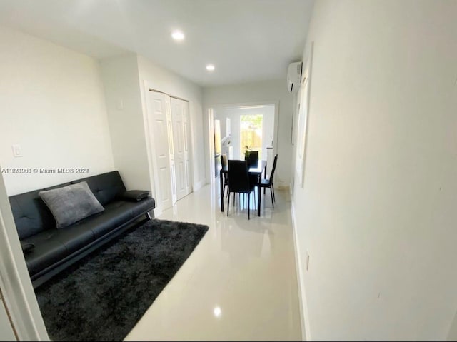 living room with a wall mounted air conditioner