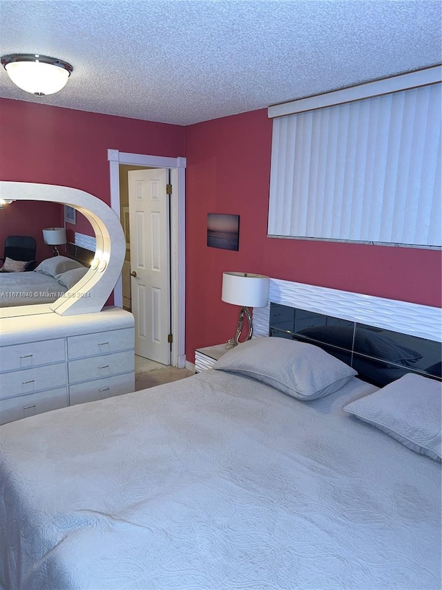 bedroom featuring a textured ceiling