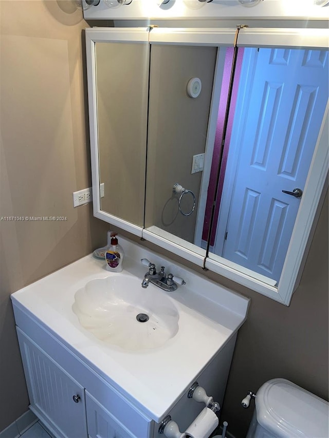 bathroom with vanity and toilet