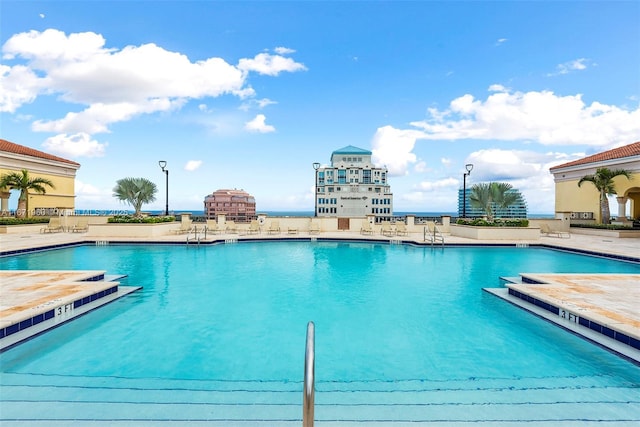 community pool featuring a patio area